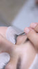 Lash stylist applying eyelash extensions close-up