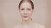 Woman applying mascara close-up